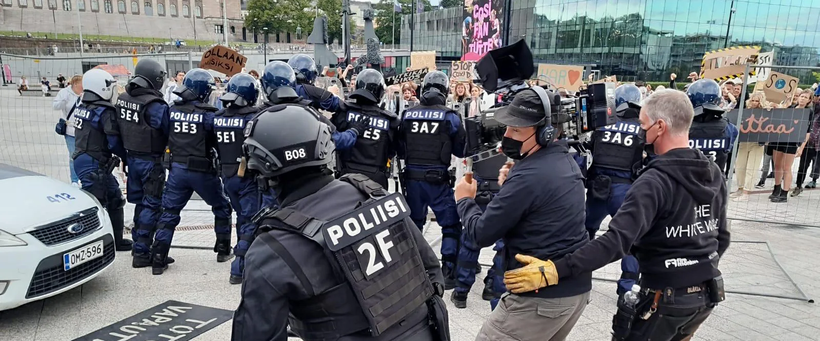 Film crew working within a large public-space production