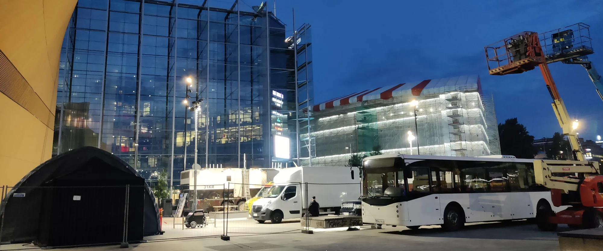 Production vehicles, lighting equipment and technical basecamp at night
